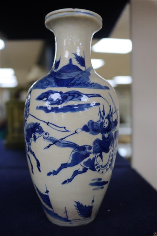 A Chinese blue and white soft paste porcelain vase, 18th century, with a Kangxi mark, 18cm